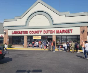 Colorful displays of fresh produce and handmade goods at Lancaster County Dutch Market in Germantown, MD.